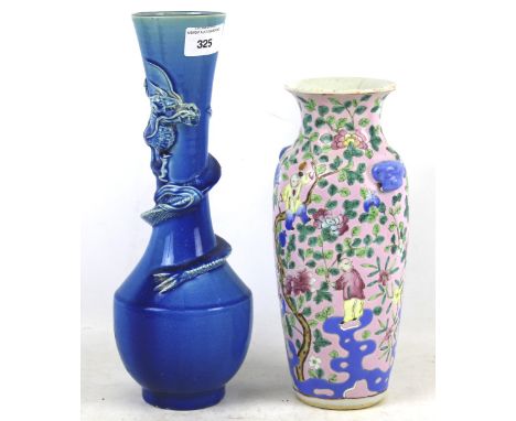 Two Chinese ceramic vases. One glazed in blue with dragon raised around the neck, the other with a floral decoration, H25cm. 