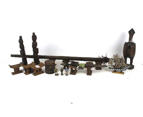 A collection of assorted West African tribal art and souvenirs. Including a leather covered sword stick 85cm long, carved woo