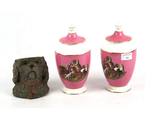 A pair of Coalport Prattware 'Group of Dogs' limited edition lidded pots and a pot modelled as a dog's head. The pots with th