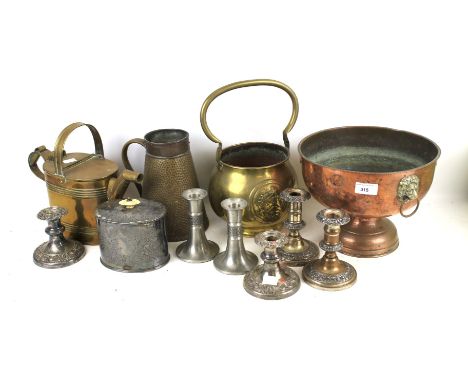 A box of assorted copper brass and silver . Comprising candlesticks, watering can, bowl and jug, etc. 