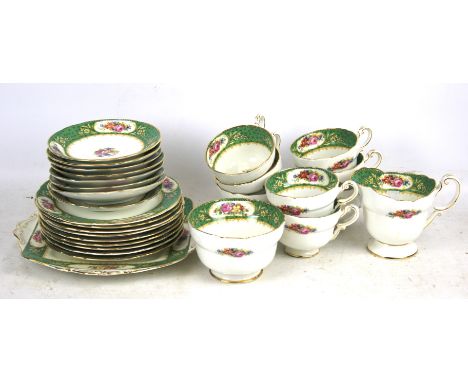 A paragon tea set. White and green with floral detail comprising eight cups, saucers, plates, etc. 