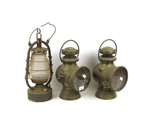 A pair of vintage Lucas brass car head lamps and a storm lantern. The first 'King of the Road'. Rd 410777 both with burner, H