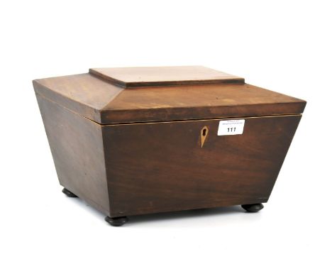 A Victorian veneered tea caddy. Of tapering rectangular form, raised on bun feet, L30.5cm