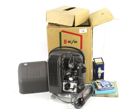 A vintage Japanese Bell-Scope R50 8mm film projector. Complete with three films and a spare bulb, in original box. 