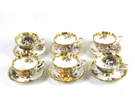 A collection of Royal Albert cups and saucers. Comprising a set of six cups and saucers with floral design. 