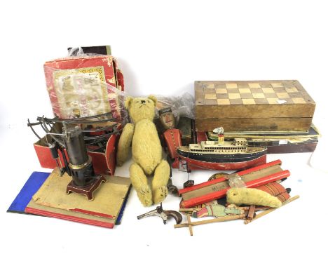 A collection of vintage toys and games. Including a tin plate clockwork ship, a train set, a German made 'EP' stationary live