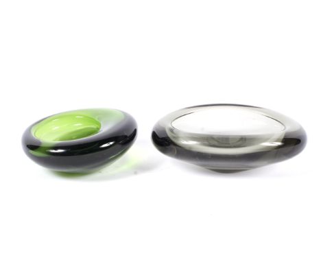 Two mid-century Holmegaard thick walled small glass dishes by Per Lutken. One in green, etched PL for Per Lutken and with ind