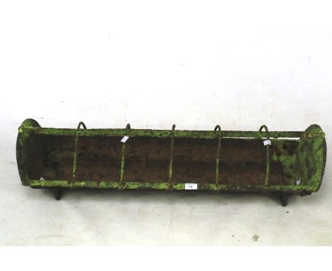 A cast iron pig trough. Finished in green handy size measuring, L94cm