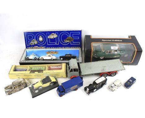 A collection of assorted diecast model cars. Including a vintage clockwork 'Foden' flatbed lorry 31cm long, a Dinky 'Guy' Eve