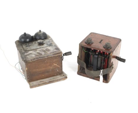 A vintage portable magneto and a wooden boxed bellset, both with hand crank. The first in a mahogany wooden box with two term
