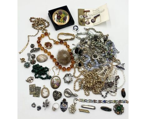 A collection of various costume jewellery, compact etc.