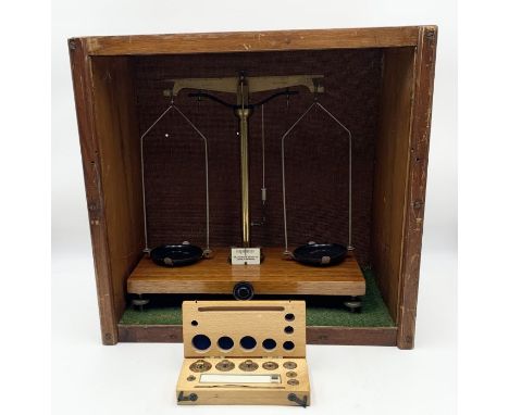 A cased set of W &amp; J George &amp; Becker Ltd (London &amp; Birmingham) balance scales with box of weights