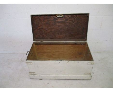 A white painted storage trunk