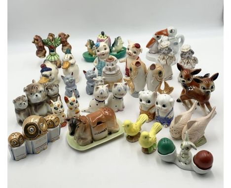 A collection of various vintage novelty salt and pepper sets mainly animal themed 