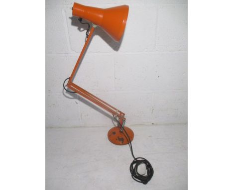An vintage orange angle poise lamp. 