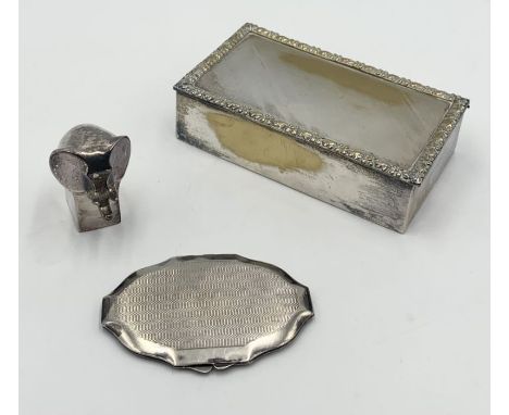 A small collection of silver plated items including a Dansk elephant paperweight, compact mirror and cigar box.