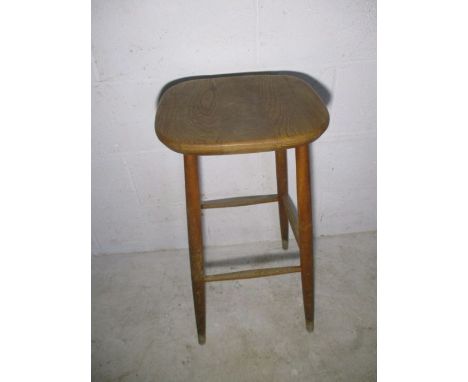 A vintage elm stool