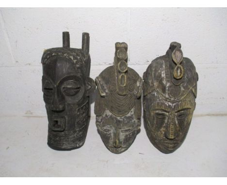 A collection of three vintage wooden African masks - one A/F