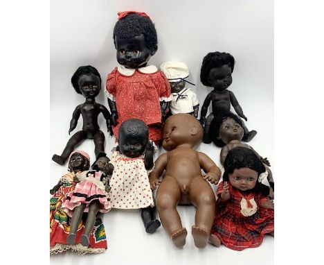 A collection of various vintage black dolls