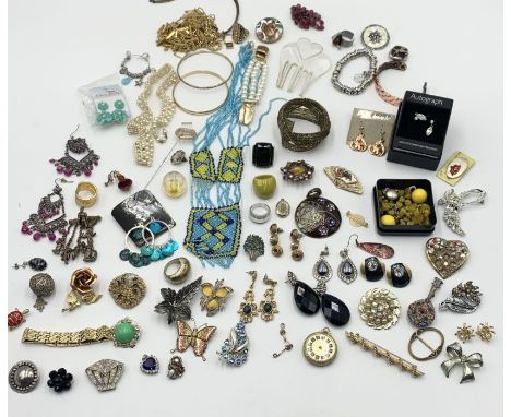 A collection of vintage costume jewellery including brooches, earrings etc