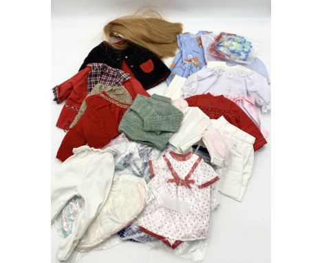 A small collection of mainly Sasha dolls clothing with one complete outfit and wig included 