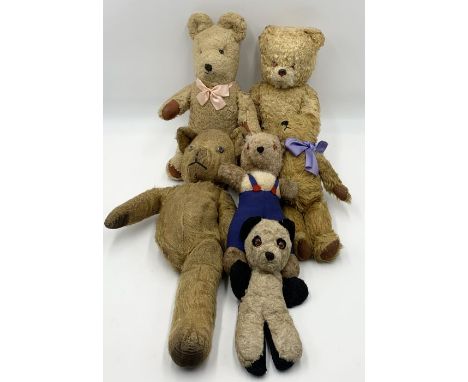 A collection of vintage teddies including a musical bear