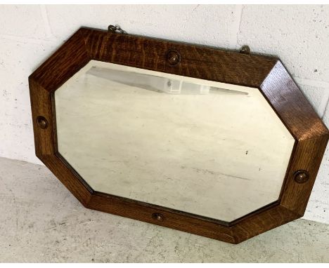 A vintage octagonal oak mirror 