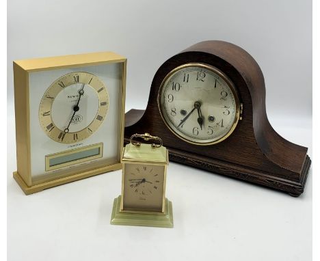 A collection of three clocks including a Sewills millennium countdown clock, a Swiss carriage clock etc.