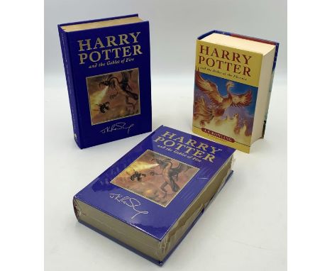 Three Harry Potter first editions comprising of two deluxe Harry Potter and the Goblet of Fire - both unread and one in origi