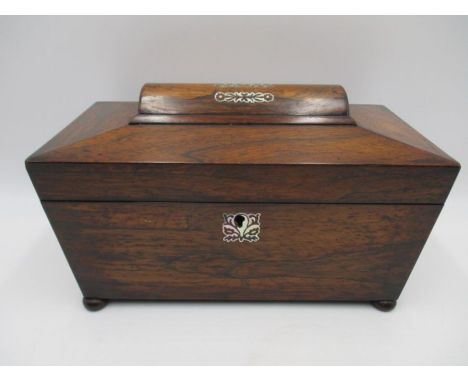 A Victorian rosewood tea caddy inlaid with mother of pearl