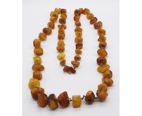 A vintage amber necklace with metal links- total weight 116g