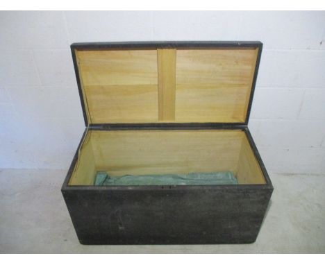 A wooden black storage trunk