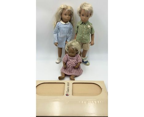 Two Sasha dolls, a blonde girl in gingham dress and a blonde boy in shorts and t-shirt with mouse in his pocket along one one