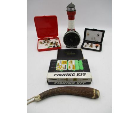 A collection of fishing items including a weighted antler "Priest", flies etc. along with a metal novelty lighter in the form