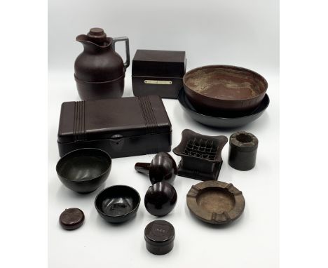 A collection of various vintage Bakelite items including thermos, tape measure etc
