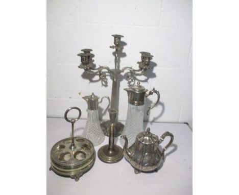 A silver plated four branch candelabra, two claret jugs etc 