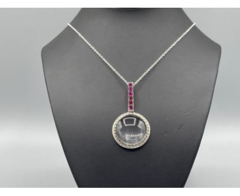 Silver and ruby magnifying glass pendant and chain