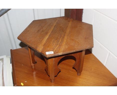 A light oak octagonal Eastern type occasional table 