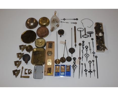 A box of various clock parts to include winding keys, bells, carriage clock escapements, pendulums, etc.