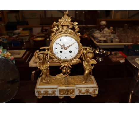 Gilbert Fabre of Paris, French gilt decorated mantel clock supported by cherubs 