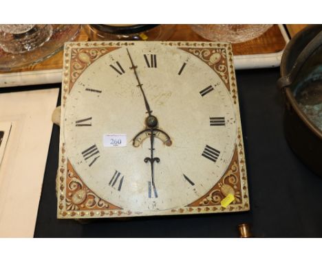 A painted and decorated clock face and movement with bell 