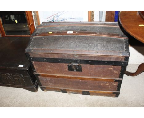 A wooden and metal bound dome topped trunk 
