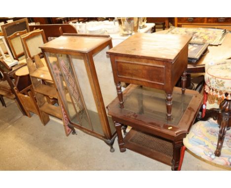 A china cabinet raised on squat cabriole supports; a two tier glass topped coffee table; and a 19th Century commode 