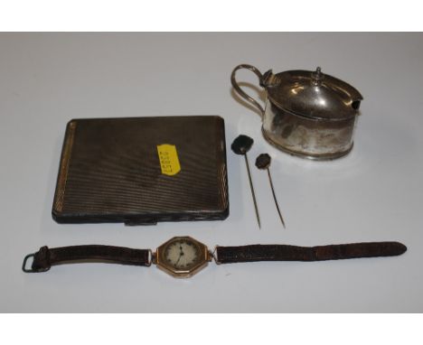 A silver cigarette case, approx. 170gms; a silver mustard pot approx. 58gms; two stick pins and a 9ct gold cased wrist watch