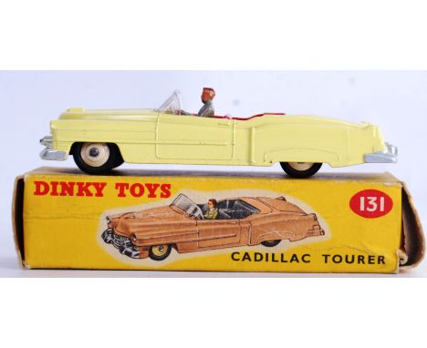 DINKY: An original vintage Dinky Toys 131 Cadillac Tourer diecast model car. Yellow variation with red interior. Within a goo