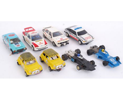 SCALEXTRIC: A collection of 8x vintage Scalextric cars - Escort, Audi Quattro, Minis, Rover Police Car, John Player Special e