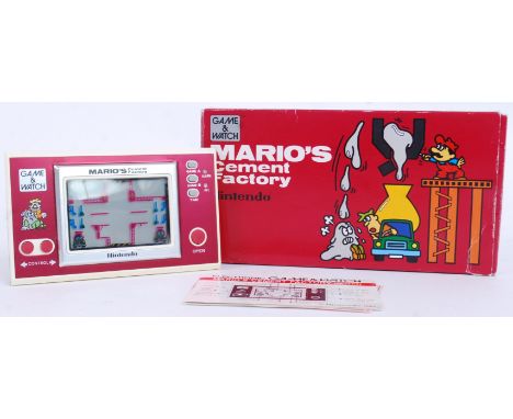 NINTENDO GAME & WATCH; An original vintage Nintendo Game & Watch Mario's Cement Factory pocket game. Within the original box,