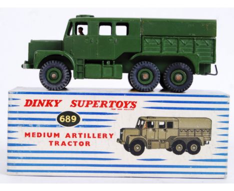 DINKY TOYS: An original vintage Dinky Toys military diecast model 689 Medium Artillery Tractor. Within the original box. Very