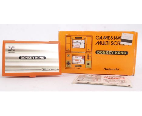 NINTENDO GAME & WATCH; An original vintage Nintendo Game & Watch Donkey Kong pocket computer game. Within the original box, w