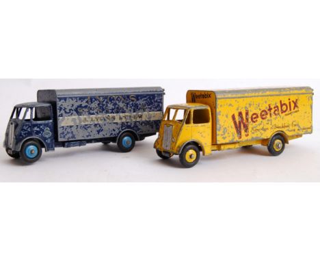 DINKY GUY VANS: Two original vintage Dinky diecast Guy model vans. The first being a Lyons Swiss Rolls van, the other being W